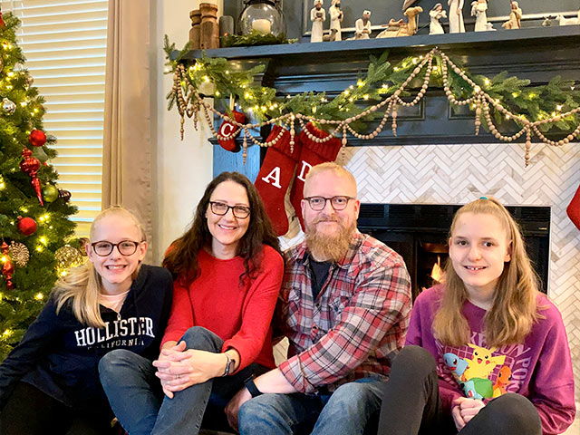 Stulpin family photo by fireplace