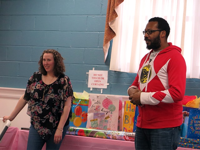 Brandon and his wife Katrina speaking at their daughter's birthday party.