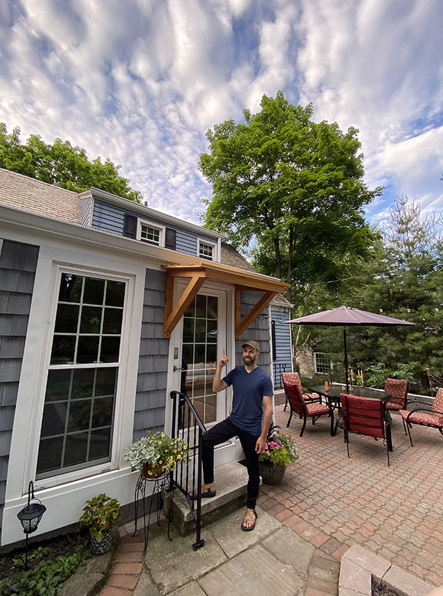 Donny pointing to awning that he made by hand.