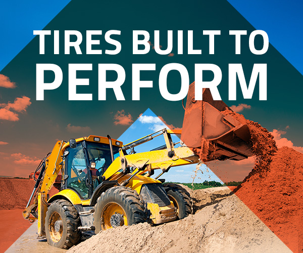 Front-end loader moving sand