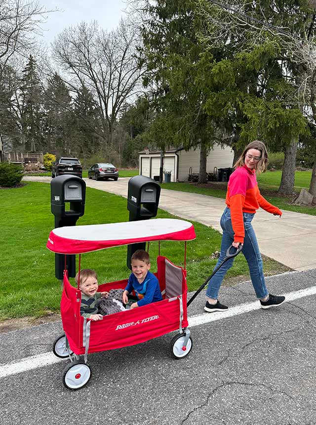 Kiersten going for walk while pulling kids in wagon