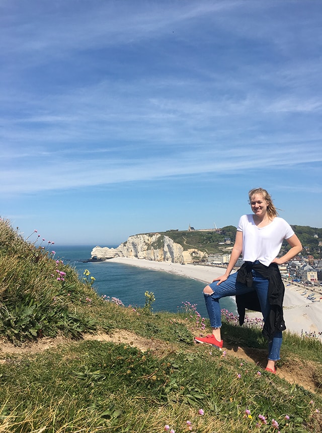 Kristen on the cliffs of Étretat in France.