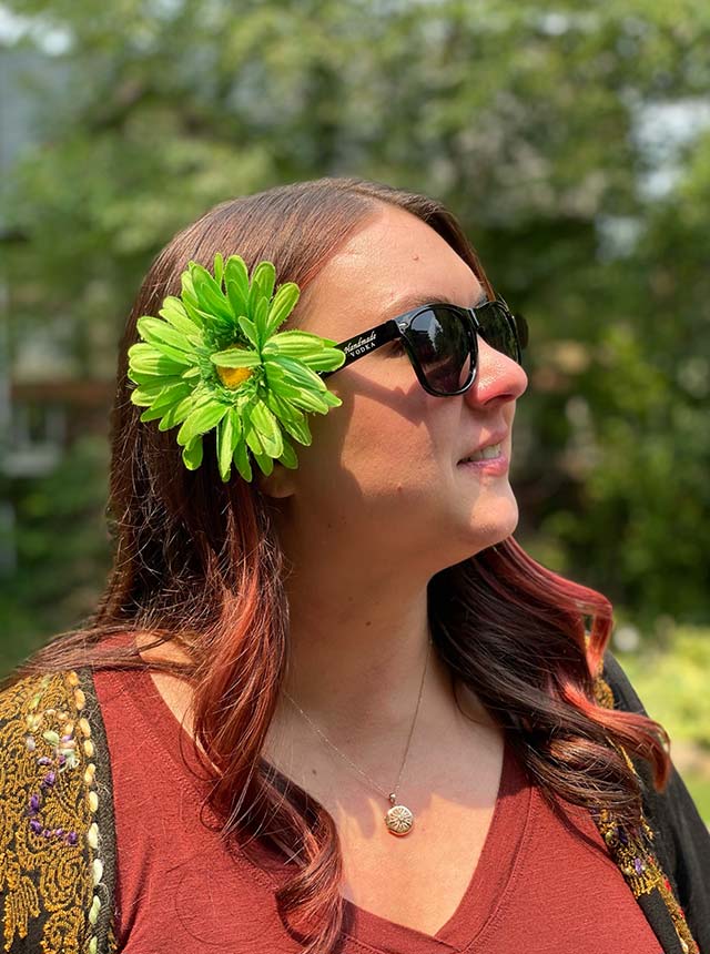 Sierra poses with her green flower