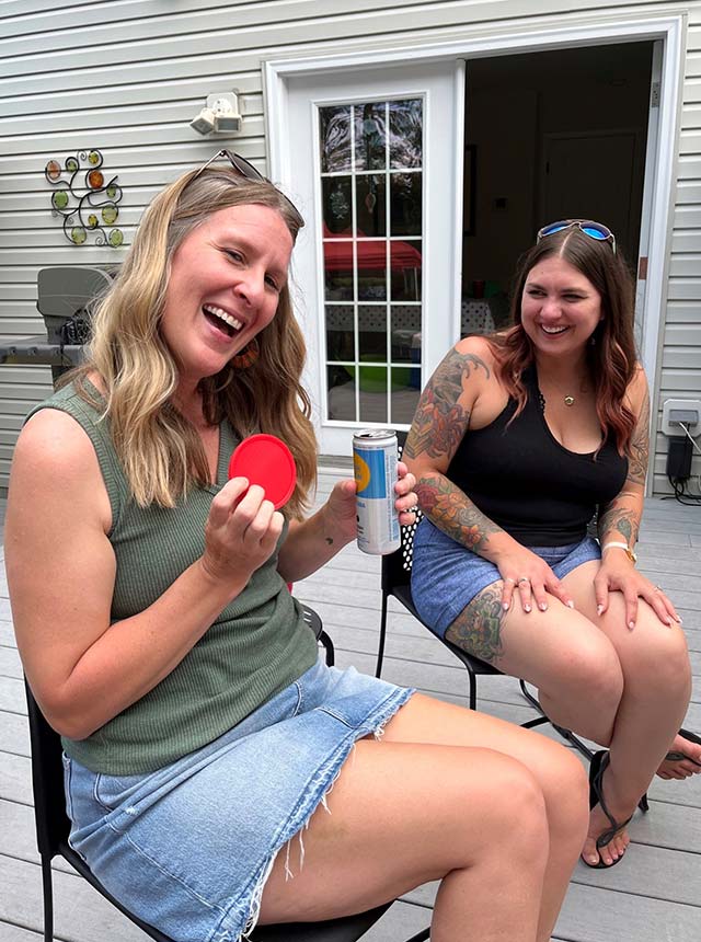 Brie and Sierra playing a game at our cookout