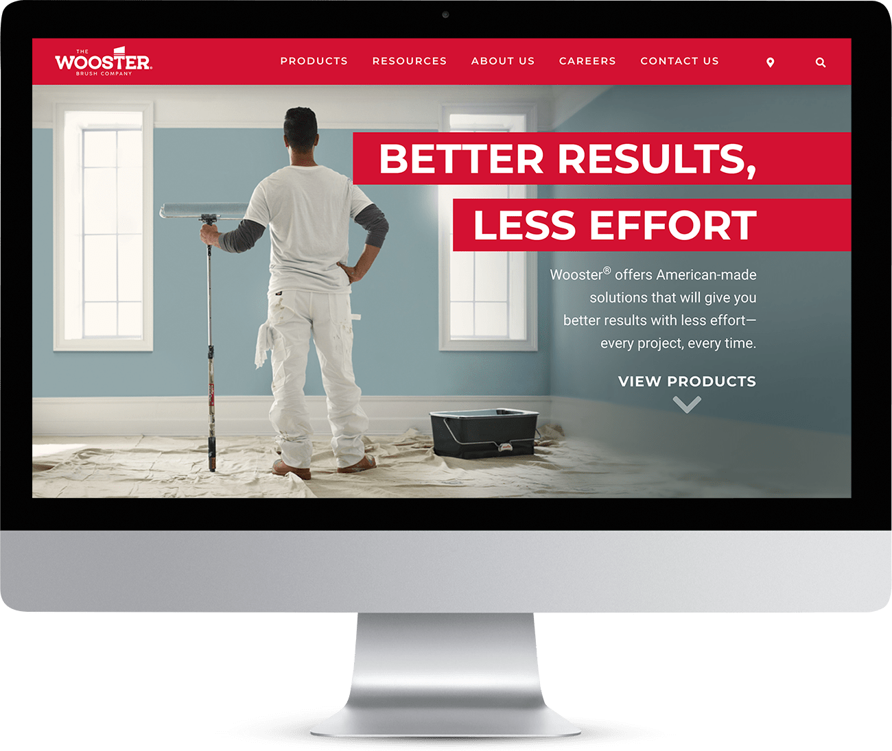 Wooster Brush website design mock-up on computer screen.