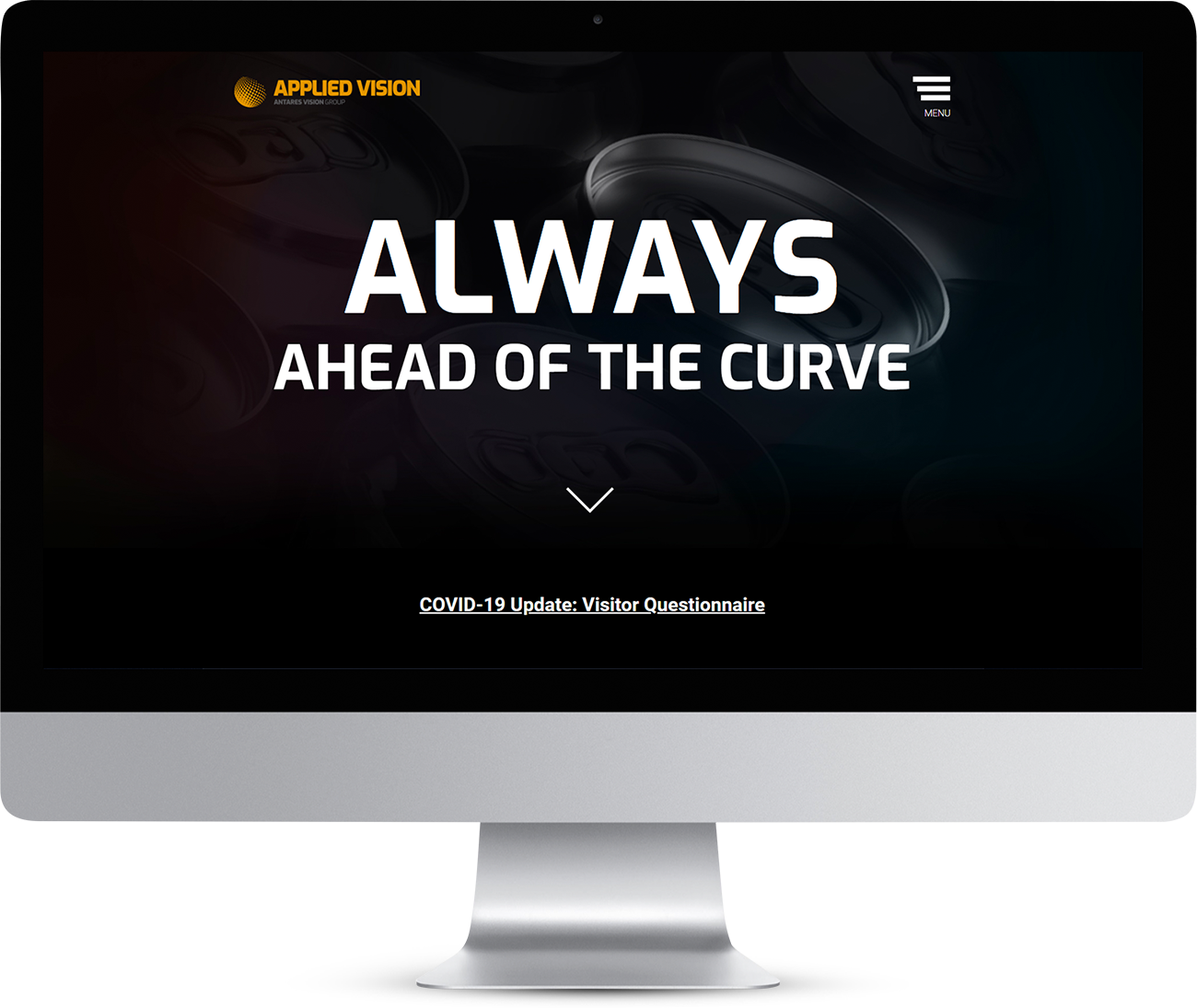 Applied Vision website homepage showing on a monitor screen