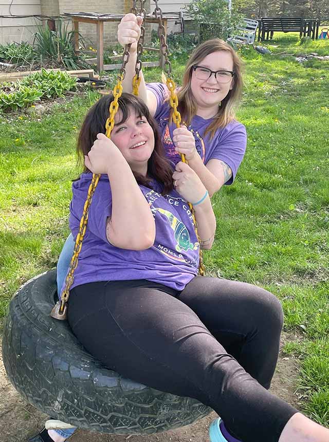 Racquel and friend on tire swing