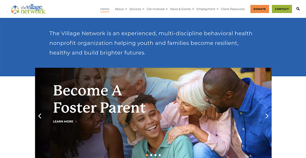 The Village Network’s website homepage, featuring a banner that reads “Become a Foster Parent” with a photo of a diverse, smiling family.