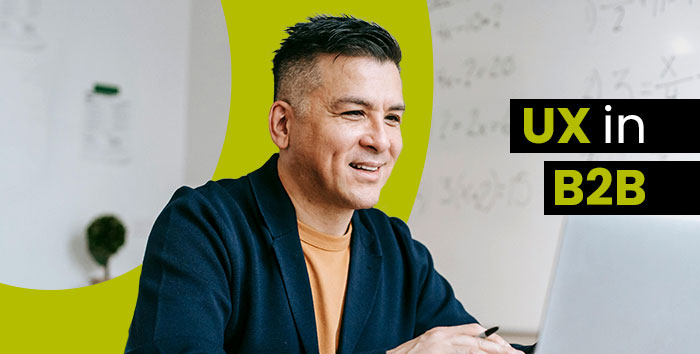 Man working on a computer and smiling